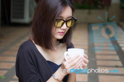 Portrait Of Thai Adult Glasses Beautiful Girl Drinking Coffee Stock Photo