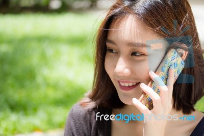 Portrait Of Thai Adult Student University Beautiful Girl Calling Smart Phone Stock Photo