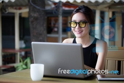 Portrait Of Thai Adult Student University Beautiful Girl Using Her Laptop Stock Photo