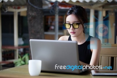 Portrait Of Thai Adult Student University Beautiful Girl Using Her Laptop Stock Photo