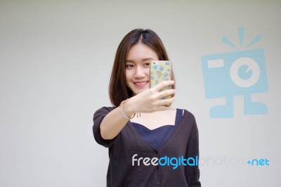 Portrait Of Thai Adult Student University Beautiful Girl Using Her Smart Phone Selfie Stock Photo