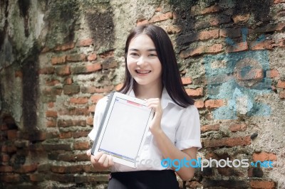 Portrait Of Thai Adult Student University Beautiful Girl Using Her Tablet Stock Photo