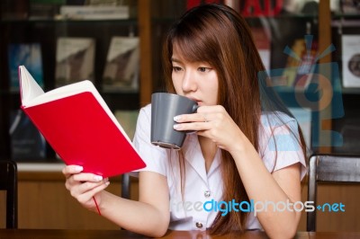 Portrait Of Thai Adult Student University Uniform Beautiful Drinking Coffee Stock Photo