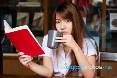 Portrait Of Thai Adult Student University Uniform Beautiful Drinking Coffee Stock Photo