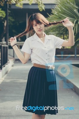 Portrait Of Thai Adult Student University Uniform Beautiful Girl Relax And Smile Stock Photo