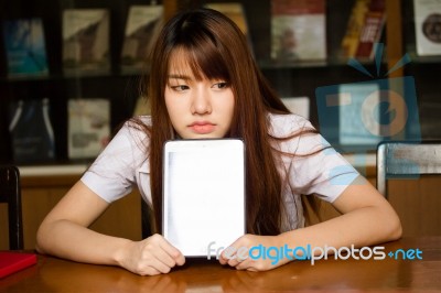 Portrait Of Thai Adult Student University Uniform Beautiful Girl Using Her Tablet Stock Photo