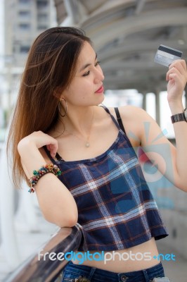 Portrait Of Thai Chinese Adult Beautiful Girl Denim Blue Bag Credit Card Stock Photo