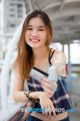 Portrait Of Thai Chinese Adult Beautiful Girl Denim Blue Bag Credit Card Stock Photo