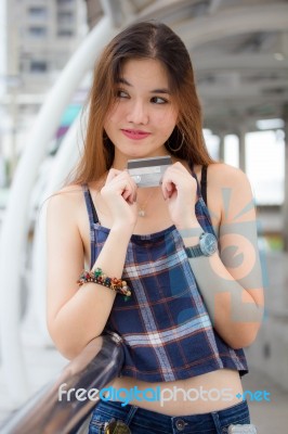 Portrait Of Thai Chinese Adult Beautiful Girl Denim Blue Bag Credit Card Stock Photo