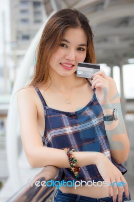 Portrait Of Thai Chinese Adult Beautiful Girl Denim Blue Bag Credit Card Stock Photo