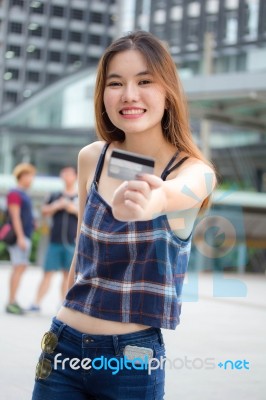 Portrait Of Thai Chinese Adult Beautiful Girl Denim Blue Bag Credit Card Stock Photo