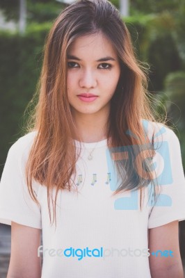 Portrait Of Thai Chinese Adult Beautiful Girl Denim Blue Bag Relax And Smile Stock Photo