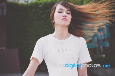 Portrait Of Thai Chinese Adult Beautiful Girl Denim Blue Bag Relax And Smile Stock Photo