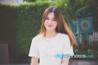 Portrait Of Thai Chinese Adult Beautiful Girl Denim Blue Bag Relax And Smile Stock Photo