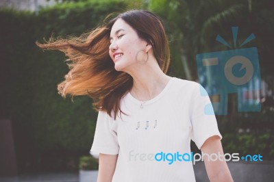 Portrait Of Thai Chinese Adult Beautiful Girl Denim Blue Bag Relax And Smile Stock Photo