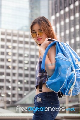 Portrait Of Thai Chinese Adult Beautiful Girl Denim Blue Bag Travel Relax And Smile Stock Photo