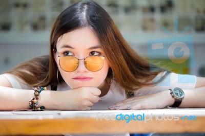 Portrait Of Thai Chinese Adult Glasses Beautiful Girl Denim Blue Bag Relax And Smile Stock Photo