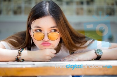 Portrait Of Thai Chinese Adult Glasses Beautiful Girl Denim Blue Bag Relax And Smile Stock Photo