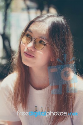 Portrait Of Thai Chinese Adult Glasses Beautiful Girl Denim Blue Bag Relax And Smile Stock Photo