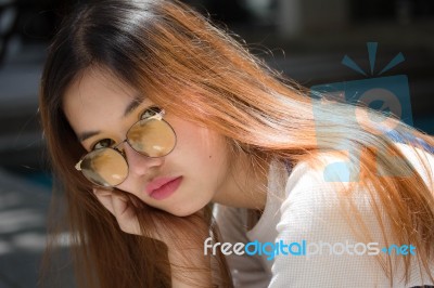 Portrait Of Thai Chinese Adult Glasses Beautiful Girl Denim Blue Bag Relax And Smile Stock Photo