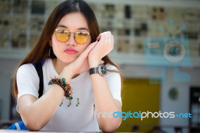 Portrait Of Thai Chinese Adult Glasses Beautiful Girl Denim Blue Bag Relax And Smile Stock Photo