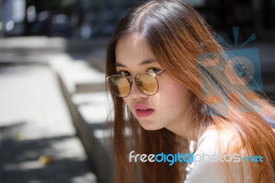 Portrait Of Thai Chinese Adult Glasses Beautiful Girl Denim Blue Bag Relax And Smile Stock Photo