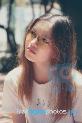 Portrait Of Thai Chinese Adult Glasses Beautiful Girl Denim Blue Bag Relax And Smile Stock Photo