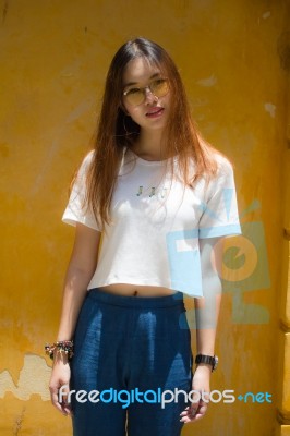 Portrait Of Thai Chinese Adult Glasses Beautiful Girl Denim Blue Bag Relax And Smile Stock Photo