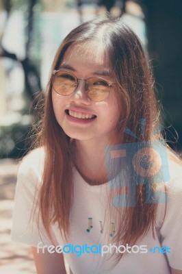 Portrait Of Thai Chinese Adult Glasses Beautiful Girl Denim Blue Bag Relax And Smile Stock Photo