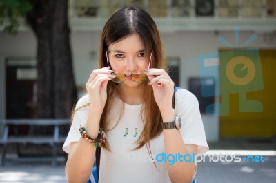 Portrait Of Thai Chinese Adult Glasses Beautiful Girl Denim Blue Bag Relax And Smile Stock Photo