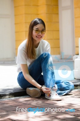 Portrait Of Thai Chinese Adult Glasses Beautiful Girl Denim Blue Bag Relax And Smile Stock Photo