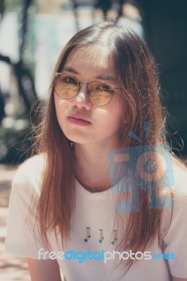 Portrait Of Thai Chinese Adult Glasses Beautiful Girl Denim Blue Bag Relax And Smile Stock Photo