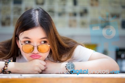 Portrait Of Thai Chinese Adult Glasses Beautiful Girl Denim Blue Bag Relax And Smile Stock Photo