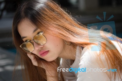 Portrait Of Thai Chinese Adult Glasses Beautiful Girl Denim Blue Bag Relax And Smile Stock Photo