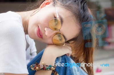 Portrait Of Thai Chinese Adult Glasses Beautiful Girl Denim Blue Bag Relax And Smile Stock Photo