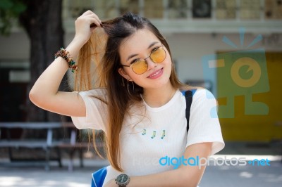 Portrait Of Thai Chinese Adult Glasses Beautiful Girl Denim Blue Bag Relax And Smile Stock Photo