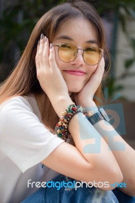 Portrait Of Thai Chinese Adult Glasses Beautiful Girl Denim Blue Bag Relax And Smile Stock Photo