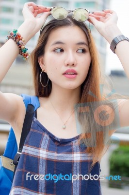 Portrait Of Thai Chinese Adult Glasses Beautiful Girl Denim Blue Bag Relax And Smile Stock Photo