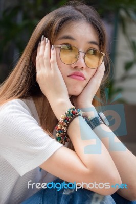 Portrait Of Thai Chinese Adult Glasses Beautiful Girl Denim Blue Bag Relax And Smile Stock Photo