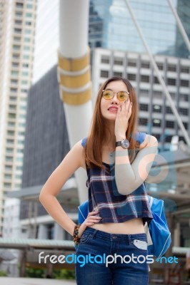 Portrait Of Thai Chinese Adult Glasses Beautiful Girl Denim Blue Calling Smart Phone Stock Photo