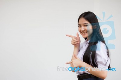 Portrait Of Thai High School Student Uniform Beautiful Girl Pointing Stock Photo