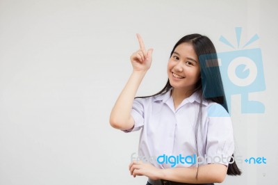 Portrait Of Thai High School Student Uniform Beautiful Girl Pointing Stock Photo