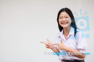 Portrait Of Thai High School Student Uniform Beautiful Girl Pointing Stock Photo