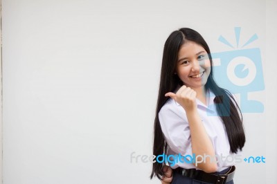 Portrait Of Thai High School Student Uniform Beautiful Girl Pointing Stock Photo