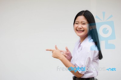 Portrait Of Thai High School Student Uniform Beautiful Girl Pointing Stock Photo