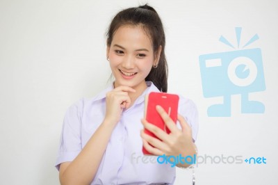 Portrait Of Thai High School Student Uniform Beautiful Girl Using Her Smart Phone Selfie Stock Photo