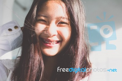 Portrait Of Thai Student Teen Beautiful Girl Relax And Smile Stock Photo