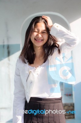 Portrait Of Thai Student Teen Beautiful Girl Relax And Smile Stock Photo