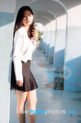 Portrait Of Thai Student Teen Beautiful Girl Relax And Smile Stock Photo