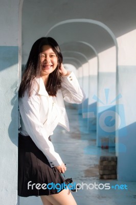 Portrait Of Thai Student Teen Beautiful Girl Relax And Smile Stock Photo